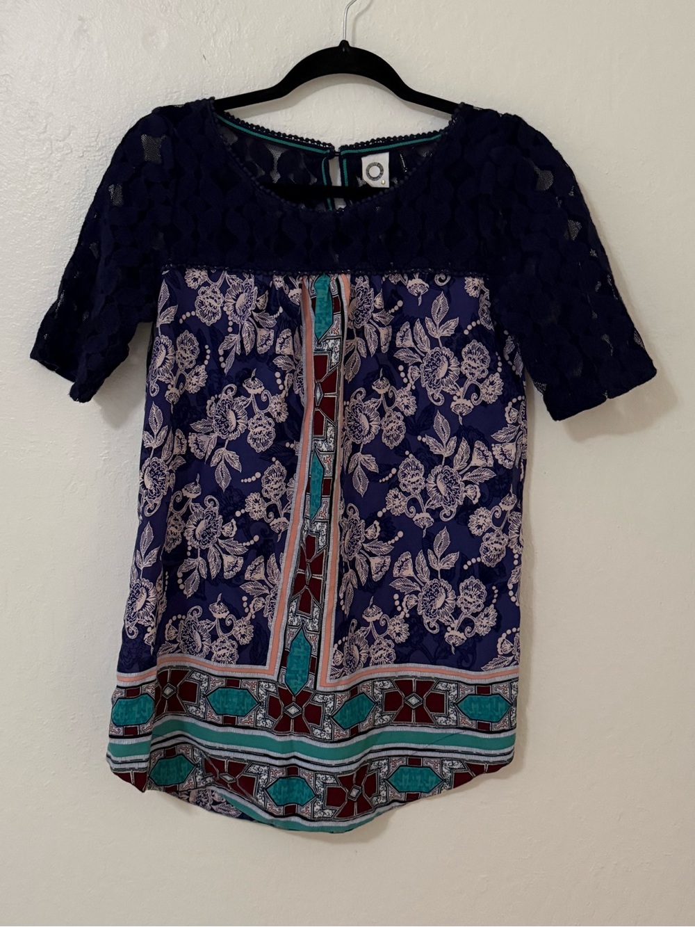 Akemi & Kin Anthropologie tunic blouse features a detailed bohemian pattern